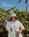 Nueva Vida bucket hat brown influencer styling Australian boutique resort accessories White Lotus inspired